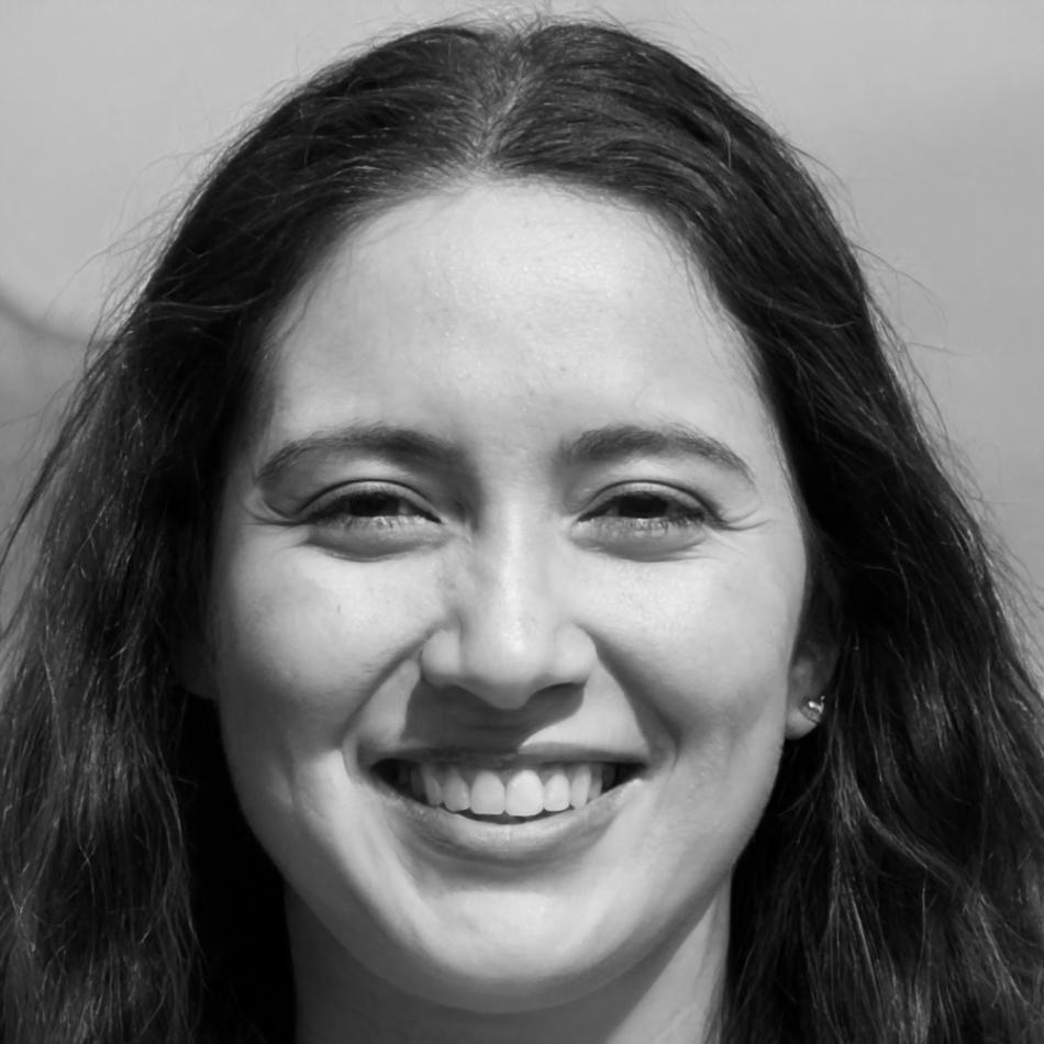 Freya Ingvarsson sitting at desk reviewing financial mindset materials